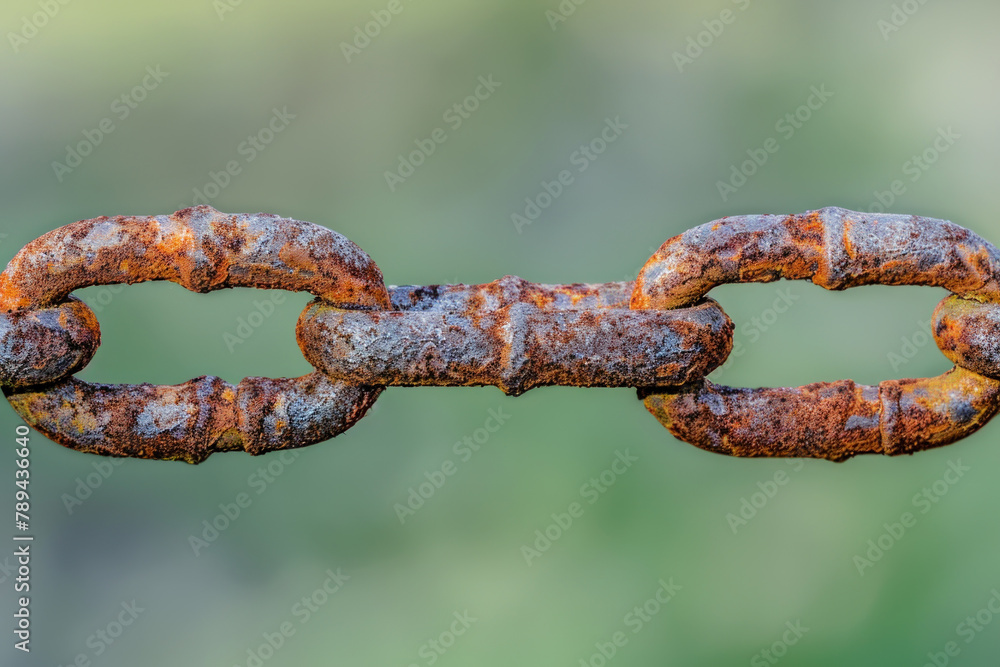 close up of a rusted chain with a blurred background close up of a rusted chain with a blurred background
