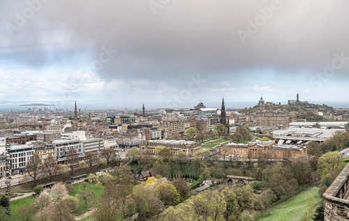 View of Edinburgh Skyline including Carlton Hill, the St James Quarter building, with rain clouds over the Firth of Forth in the distance photo
