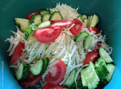 delicious fresh salad of cabbage, cucumber and tomatoes