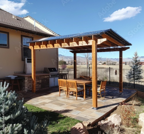 A wooden deck with an attached arbor and roof on the side, patio cover installation, full view of backyard in Colorado