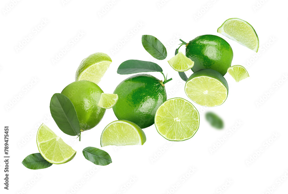 Fresh ripe limes in air on white background