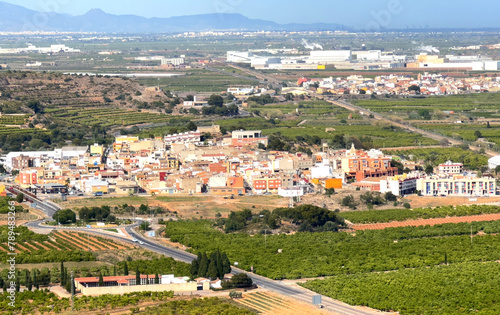 Town with Buildings, houses and streets. City building, aerial view. View of rooftops and streets of La Llosa, Castello, Spain. Roofs of houses from mountains of Castle. View of city from mountain.