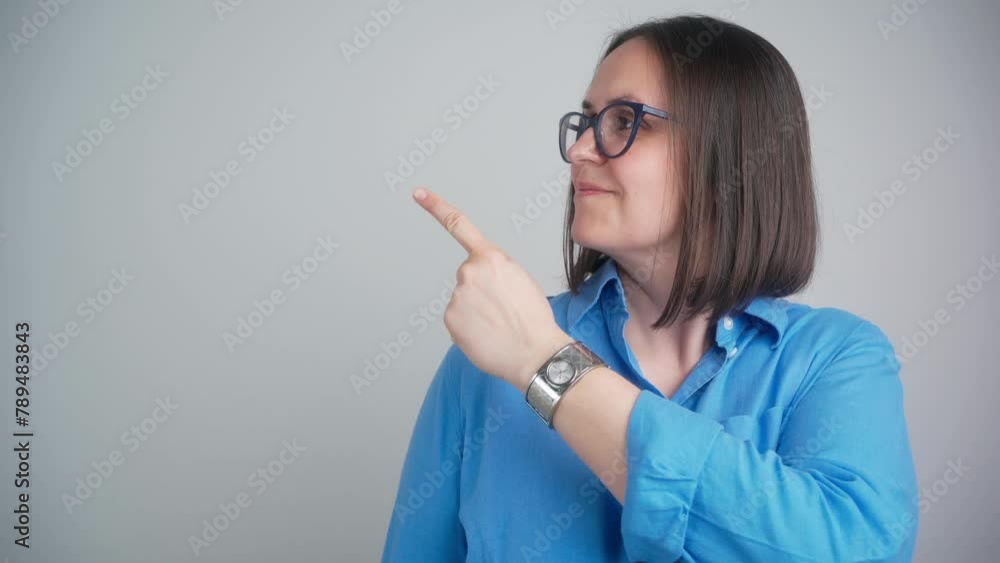 Amazed surprised brunette woman 40s wearing blue shirt posing isolated on grey color background studio. People lifestyle concept. Pointing index finger aside showing thumbs up say wow
Amazed surprised brunette woman 40s wearing blue shirt posing isolated on grey color background studio. People lifestyle concept. Pointing index finger aside showing thumbs up say wow