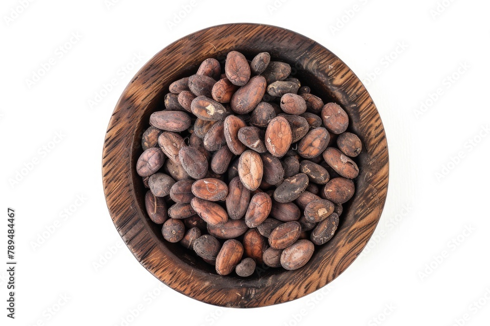 Fototapeta premium Wooden bowl filled with chocolate beans. Perfect for food and snack concepts