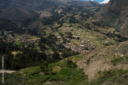 Image shows part of the beautiful city of Pisac surrounded by vegetation in the sacred valley of the Incas