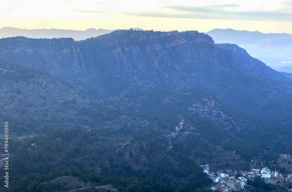 Fototapeta premium Mountains landscape from Mola De Segart in Sierra Calderona. View on Segart town, municipality in Spain, province of Valencia. Town in mountains hills. House in mountains, aerial view.
