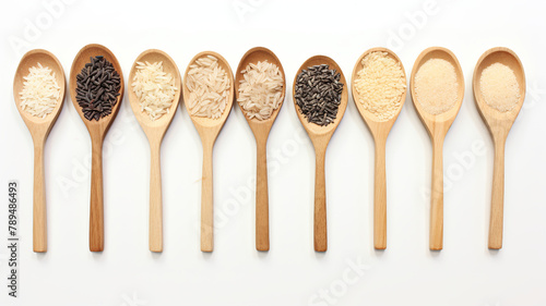 Rice and grains in various varieties, isolated on a white background using wooden spoons