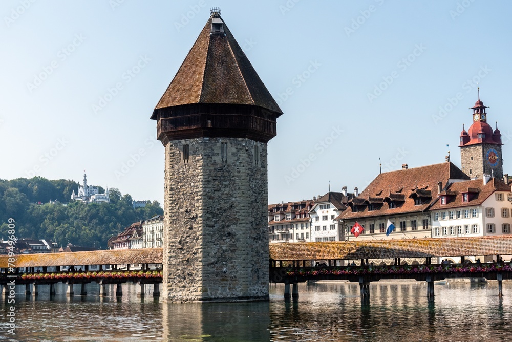 Tower wooden bridge in the city of Lucerne over the river Reuss Tower wooden bridge in the city of Lucerne over the river Reuss