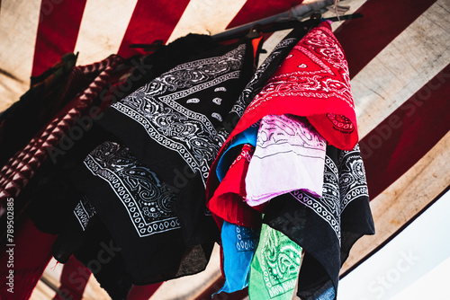 Colorful patterned scarves for sale at a market in Turin