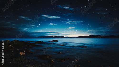 Beautiful night landscape with stars over the water. Beautiful Milky Way in the sky on a summer day. Beautiful landscape, picture, phone screensaver, copy space, advertising, travel agency, tourism