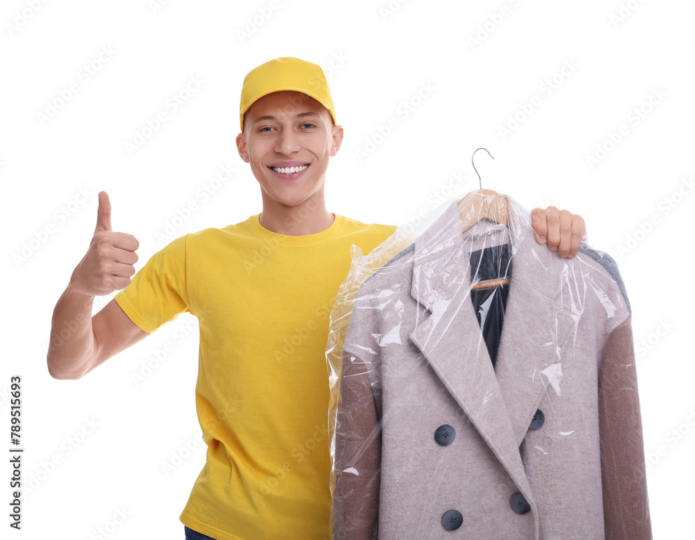 Dry-cleaning delivery. Happy courier holding coat in plastic bag and showing thumbs up on white background Dry-cleaning delivery. Happy courier holding coat in plastic bag and showing thumbs up on white background