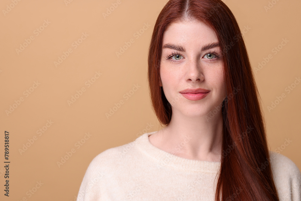 Portrait of beautiful woman on beige background. Space for text Portrait of beautiful woman on beige background. Space for text