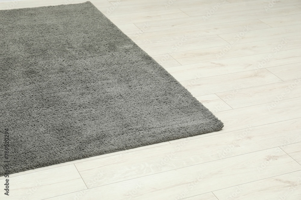 Fototapeta premium Soft grey carpet on white laminated floor indoors
