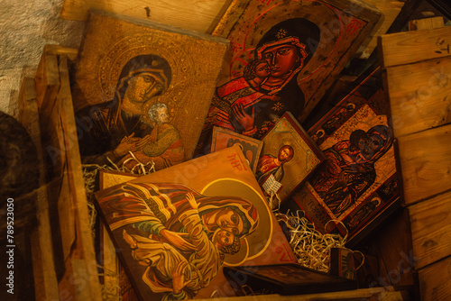 Tablou pe pânză A wooden box of ancient Orthodox icons symbolizing the communist religious repre