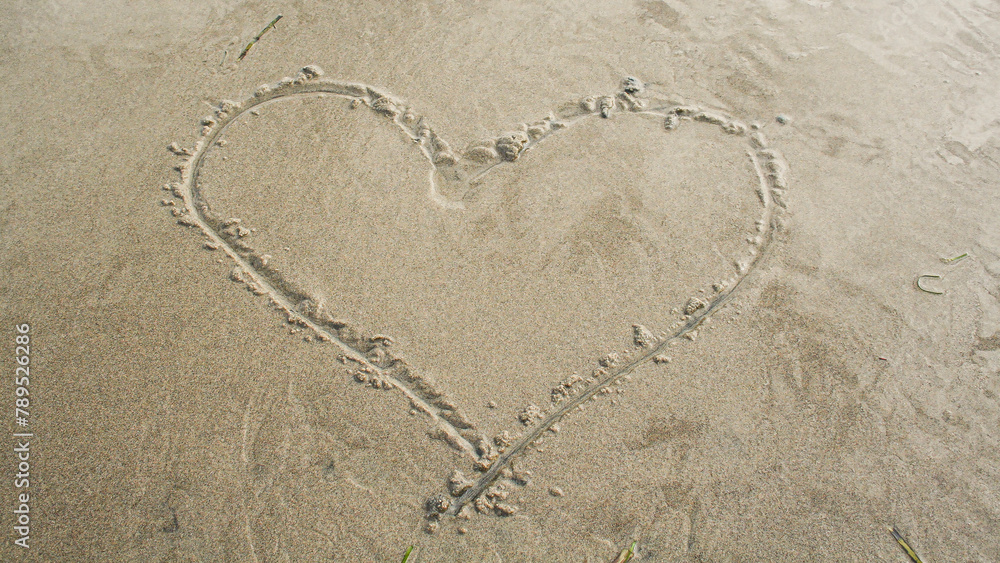 Heart drawn on a sandy beach,  - obrazy, fototapety, plakaty 