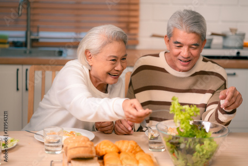 Asian Family Happiness in the Kitchen  Senior Parents Cooking Dinner with Joy  Children Laughing  A Fun and Loving Atmosphere of Togetherness  Creating Delicious Meals and Beautiful Memories