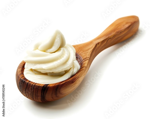 A scoop of Greek yogurt in a wooden spoon isolated on a white background with a clipping path, stock photo in the style of hd