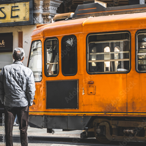 Obraz na płótnie Old orange tram in the historic city center of Turin, Italy w salonie