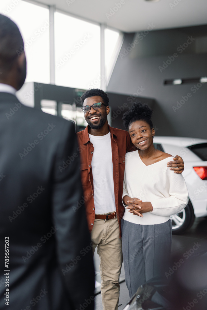 Faceless car store consultant conversation potencial foreign client Faceless car store consultant conversation potencial foreign client