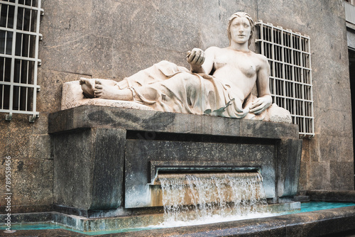 Fontaine in the city of Turin (Italy) with sculpture and statue
