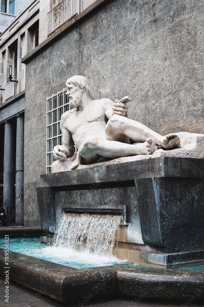 Fontaine in the city of Turin (Italy) with sculpture and statue