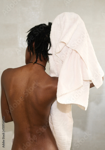woman dries her hair