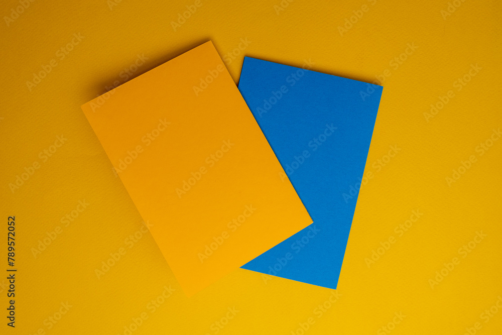 Paper yellow and blue envelopes on a color background. New mail, write a message. Send and receive mail. Postal delivery service. Empty envelope, empty space. Envelope close-up Paper yellow and blue envelopes on a color background. New mail, write a message. Send and receive mail. Postal delivery service. Empty envelope, empty space. Envelope close-up