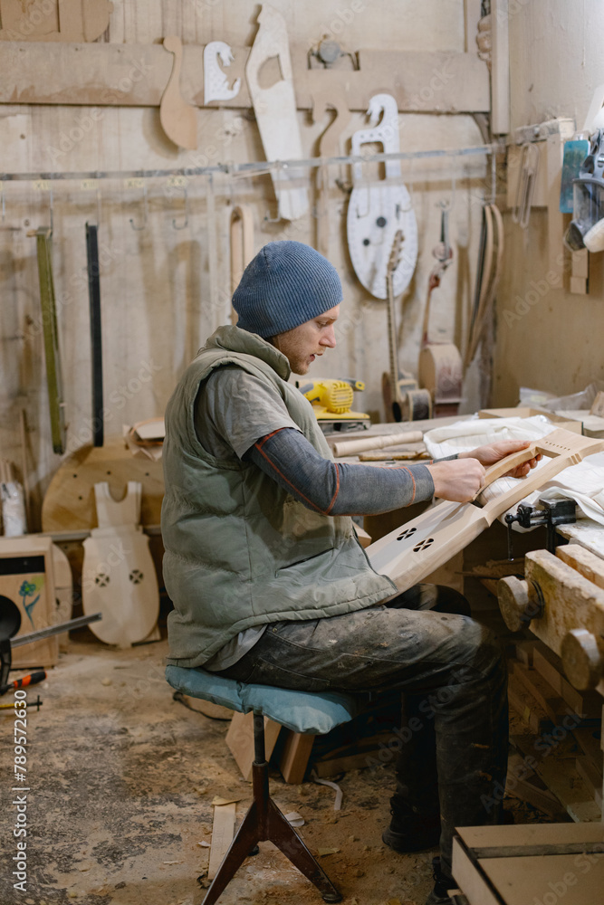 Guitar master working at his desk