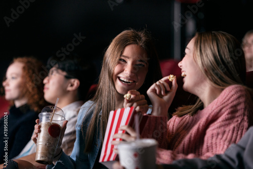 Movies: Girls Laugh While Watching Movie photo