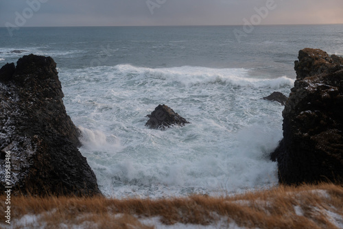 The sea is constantly eroding the rocks of Gatklettur. photo