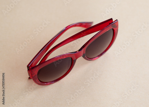 Red sunglasses on a light background