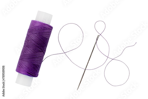 Old spool of thread and needle on a white background. Sewing accessories