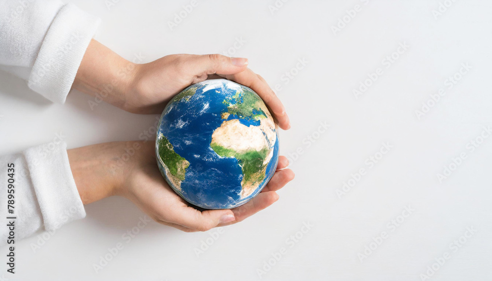 Earth globe being held by two female hands. Climate change, environment, global warming theme concept. Earth globe being held by two female hands. Climate change, environment, global warming theme concept.