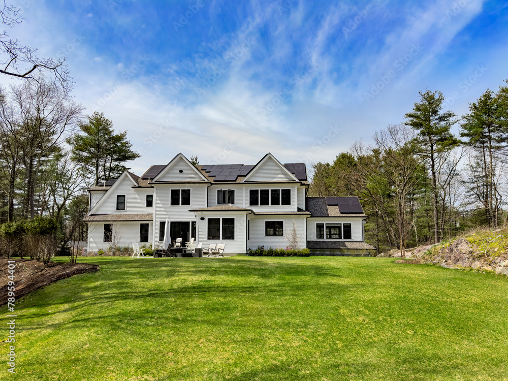 Suburban home with rooftop solar to generate renewable green energy Suburban home with rooftop solar to generate renewable green energy