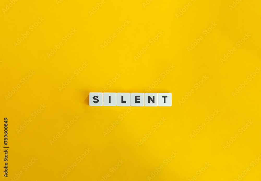 Silent Word. Text on Block letters on bright orange background. Minimal aesthetics. - obrazy, fototapety, plakaty 