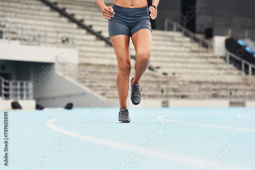 Runner, fitness and legs of woman track for athlete, exercise and sports for competition. Race, stadium and shoes for cardio event for professional female person, workout and sprint for run training