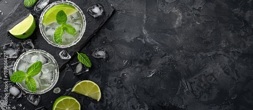 Top-down view of a Margarita cocktail on a dark stone table with room for your text.