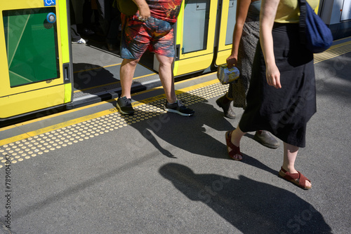 People getting off a tram in Melbourne  photo