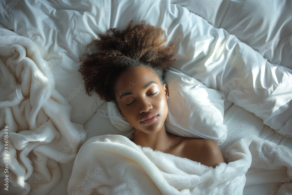 Woman Laying in Bed Under a Blanket Woman Laying in Bed Under a Blanket