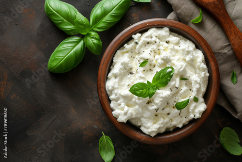 Homemade Italian ricotta cheese garnished with fresh basil leaves