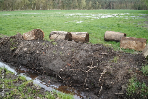 Drainage pipes clogged with mud and soil. Due to constant rainfall and a totally muddy environment, the concrete pipes have become clogged with soil and need to be replaced. Resse Wedemark, Germany.