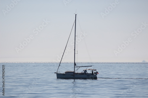 small ship in the sea of marmara with a sail  photo