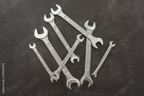 Open-end wrenches. Set of wrenches on grey background.