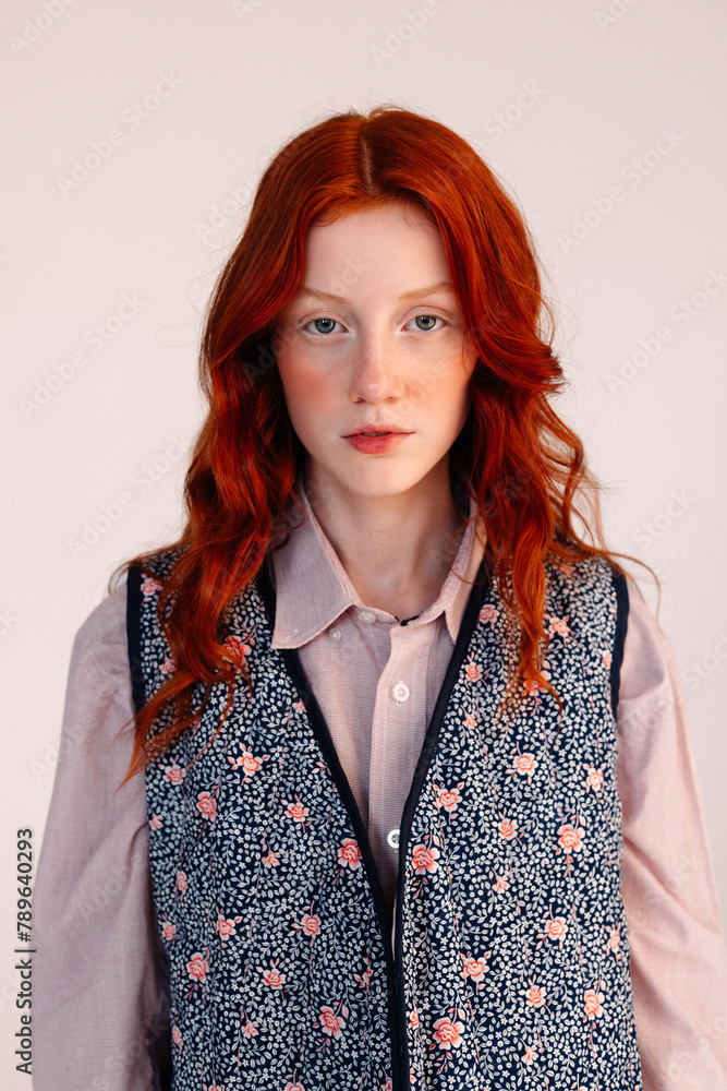 Attractive redhead girl in stylish outfit closeup Attractive redhead girl in stylish outfit closeup