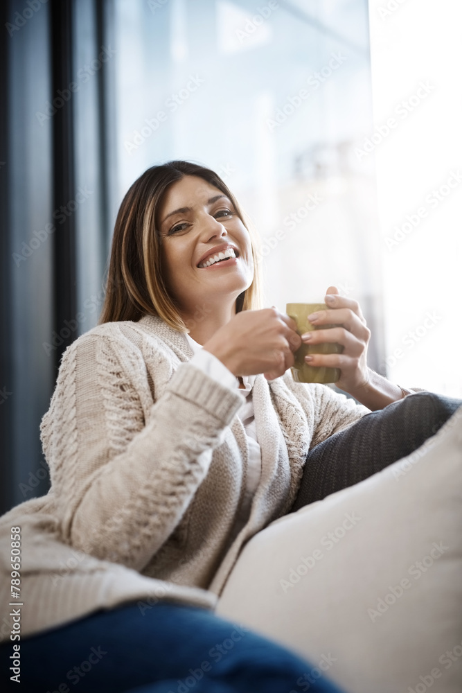 Woman, home and happy with coffee to relax on day off and leisure. Female person, sofa and smile in living room with cup of tea for lunch on break, chill and self care in portrait on couch Woman, home and happy with coffee to relax on day off and leisure. Female person, sofa and smile in living room with cup of tea for lunch on break, chill and self care in portrait on couch