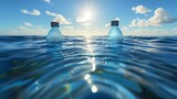 Two azure bottles of aqua floating in the blue ocean