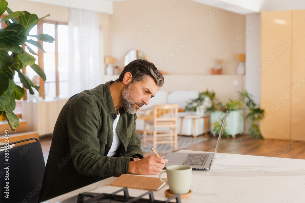 Man Managing Home Finance At Home Man Managing Home Finance At Home