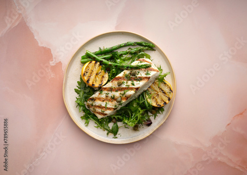 Grilled halibut with capers and greens.