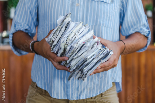 person holding a bunch of receipts  photo