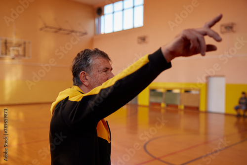 Portrait of a coach follows the game photo